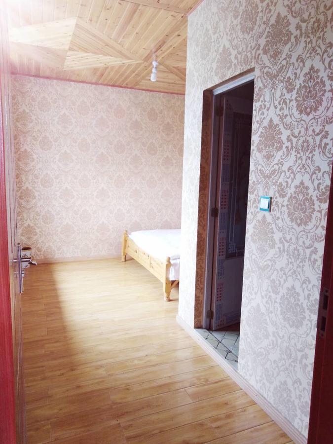 Zishuo Zihua Guest House Daocheng Extérieur photo