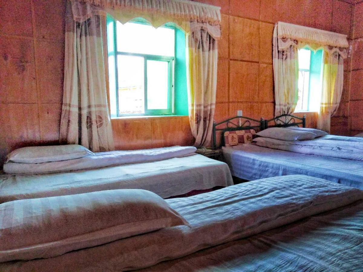 Zishuo Zihua Guest House Daocheng Extérieur photo